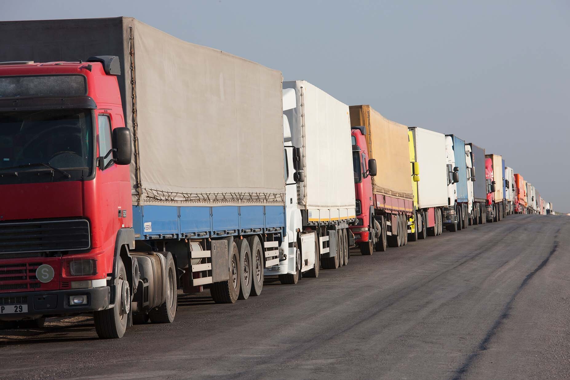 A road with trucks lined up.